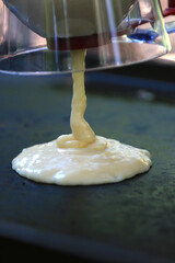 Making pancakes on outdoor griddle