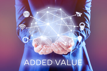 Added values concept. Businessman holding digital globe with icons, closeup