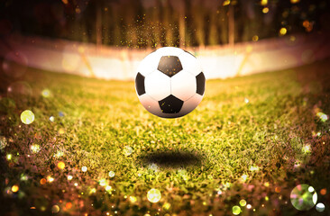 Soccer ball on football field. Bokeh effect