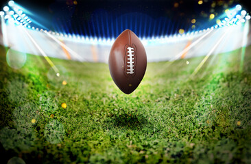 Leather American ball on green football field
