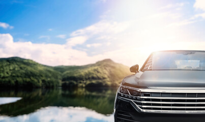 Road trip. Car near river, space for text