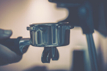 Barista using coffee machine; close-up