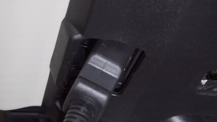 Connecting diagnostic cable to the car OBD2 protocol connector.