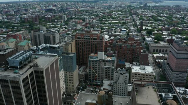 aerial view tilt down reveal of BLM sign painted on Joralemon St. in downtown Brooklyn