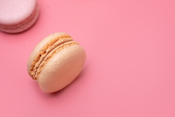 sweet popular dessert orange macaroni on pink background top view