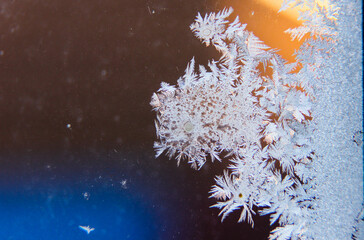 Beautiful frosty patterns on the window. place under the text. brooding morning through the ine. 