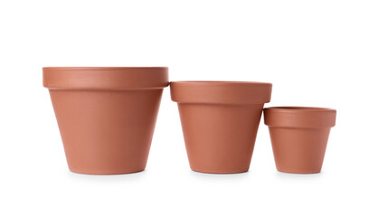 Stylish terracotta flower pots isolated on white