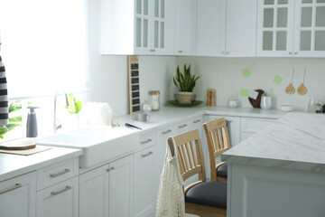 Fototapeta na wymiar Modern kitchen interior with stylish marble table