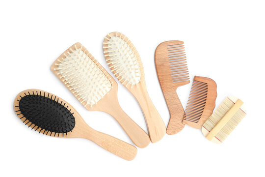 Set of modern hair combs and brushes isolated on white, top view