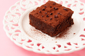 fresh homemade brownie with chocolate in dark mood style 