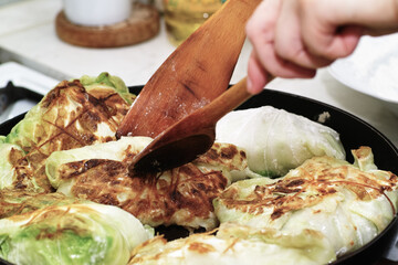 Preparing stuffed cabbage, Polish cuisine specialty.