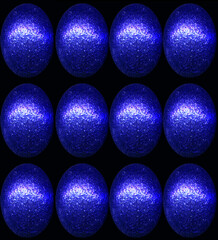 Closeup of foil wrapped chocolate easter eggs on a plain background