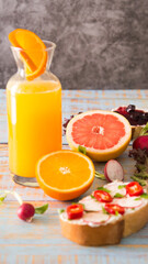 slice of bread with cream cheese and orange juice