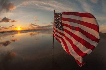 Waving US Flag at Beach Sunset