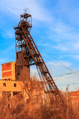 Fototapeta na wymiar Old rusty mine headgear in Kryvyi Rih, Ukraine