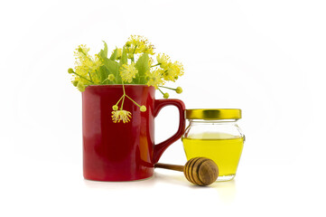 Fresh Linden flowers in red cup with honey