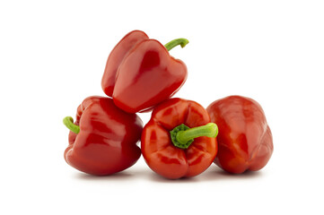 Red bell peppers on white background