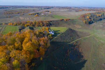 View of Truvor hillfort in golden autumn (aerial photography). Izborsk, Russia