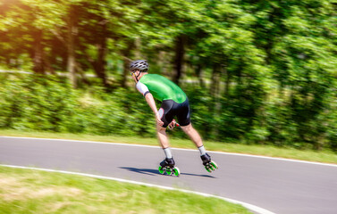 man roller skating in the summer Park
