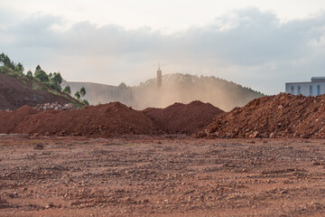 Dirt piles and dust from the wind at the construction site