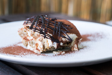 A tasty italian tiramissu plated, decorated and served.