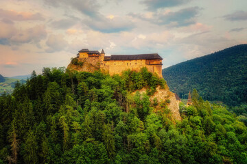 Fototapeta na wymiar Orava Castle on a huge cliff above the river valley
