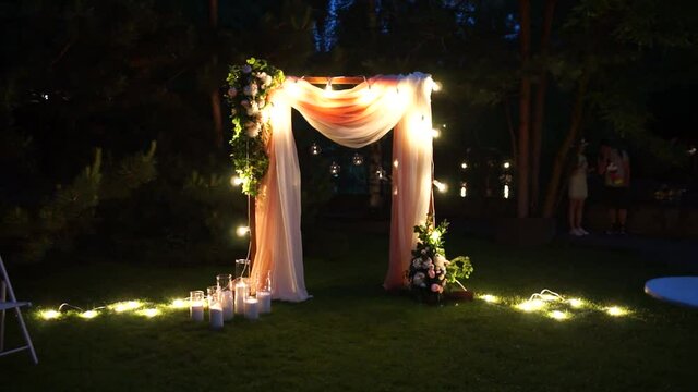 arch for a wedding ceremony at night