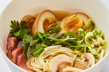 Japanese ramen soup with veal, egg, chives  - traditional Asian dish