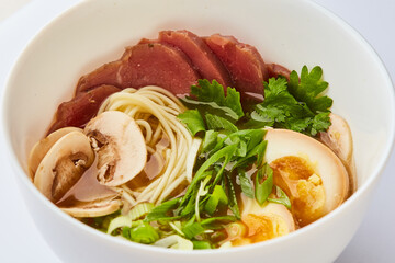Japanese ramen soup with veal, egg, chives  - traditional Asian dish