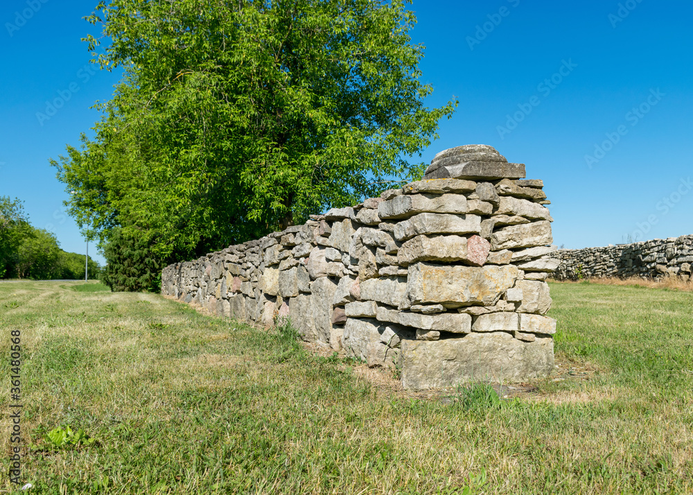 Wall mural a low stone fence on the island of saaremaa, estonia