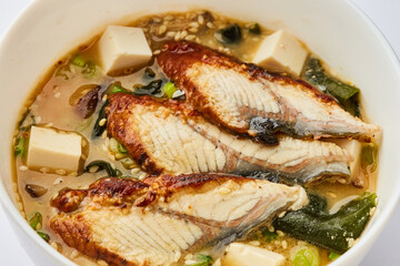 Japanese miso soup with eel in white bowl - Traditional asian dish