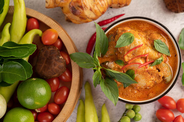 Chicken red curry in a black cup