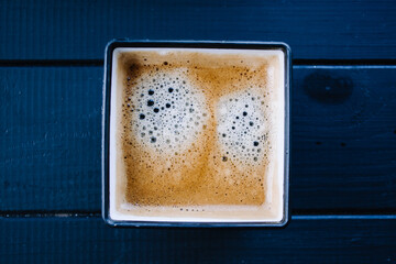 Square coffee cup on a black table. - 361482712