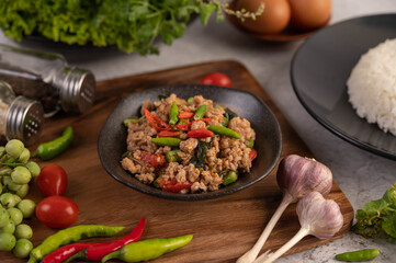 Spicy minced pork and rice on a black plate.