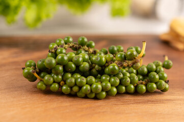 Fresh pepper seeds on the wooden table.