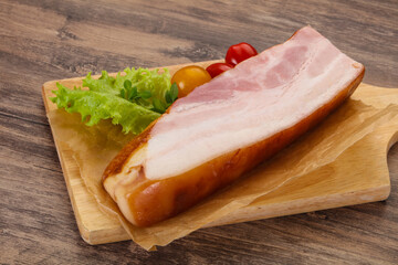 Smoked pork breast with salad leaves