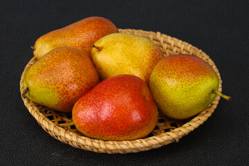 Pear heap in the wooden basket