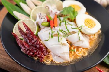 Tom Yum Mama with Squid and Boiled Egg.