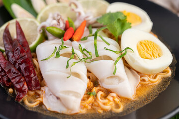 Tom Yum Mama with Squid and Boiled Egg.