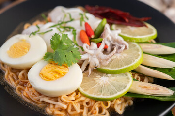 Tom Yum Mama with Squid and Boiled Egg.