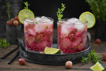 summer cocktail with gooseberries, syrup and lime