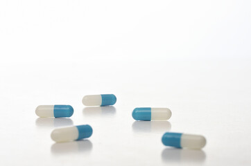 Obraz na płótnie Canvas Drug capsule isolated on white background, selective focus
