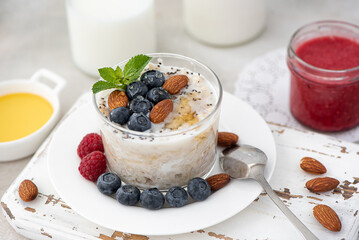 milk oatmeal with berries, honey and berry mousse