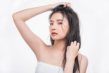 Fototapeta premium A beautiful, beautiful woman catches her messy hair.