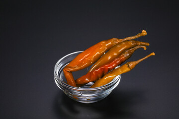 Marinated chilli pepper in the bowl