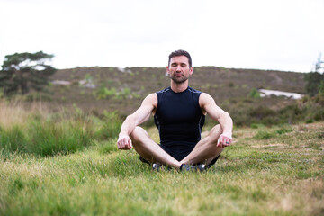 Man meditating in the countryside