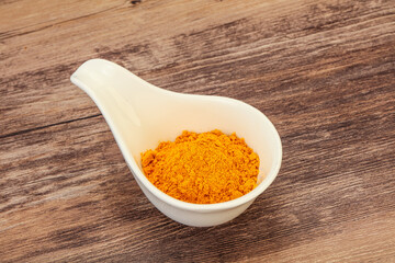 Tumeric powder in the bowl