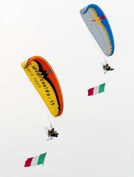 Venegono Superiore, Varese, Italy - May 5, 2011: Paragliders showing skill in the sky on a paramotors demonstration of air show.