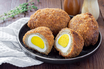 Traditional UK food, Scottish eggs, meatballs stuffed with egg in breadcrumbs.