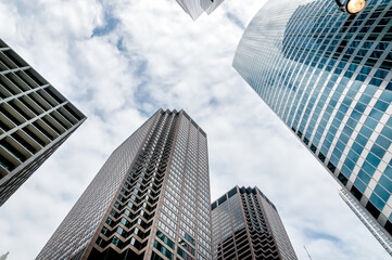 Obraz na płótnie Canvas Low angle view upwards of skyscrapers, american buildings.